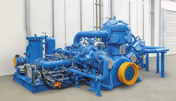 Photo of a blue SIAD oxygen compressor mounted on a skid in an industrial building